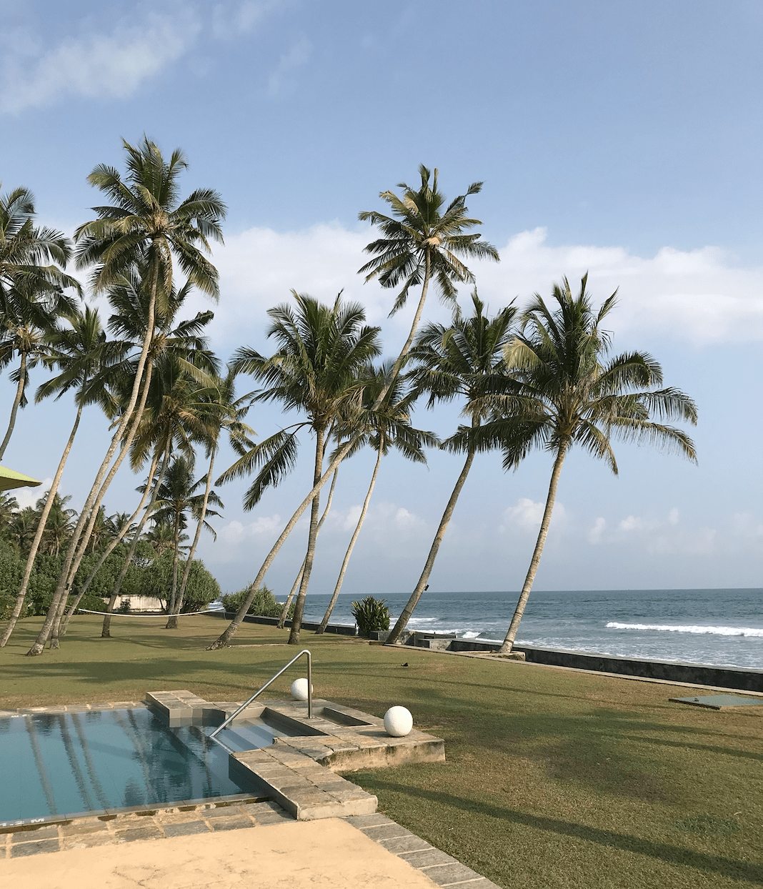 View of pool, garden and beach at Tanamera Estate near Galle in Sri Lanka