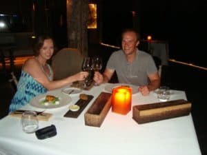 Nicola and myself having dinner at Song Saa Travellers at Song Saa having dinner with a class of wine