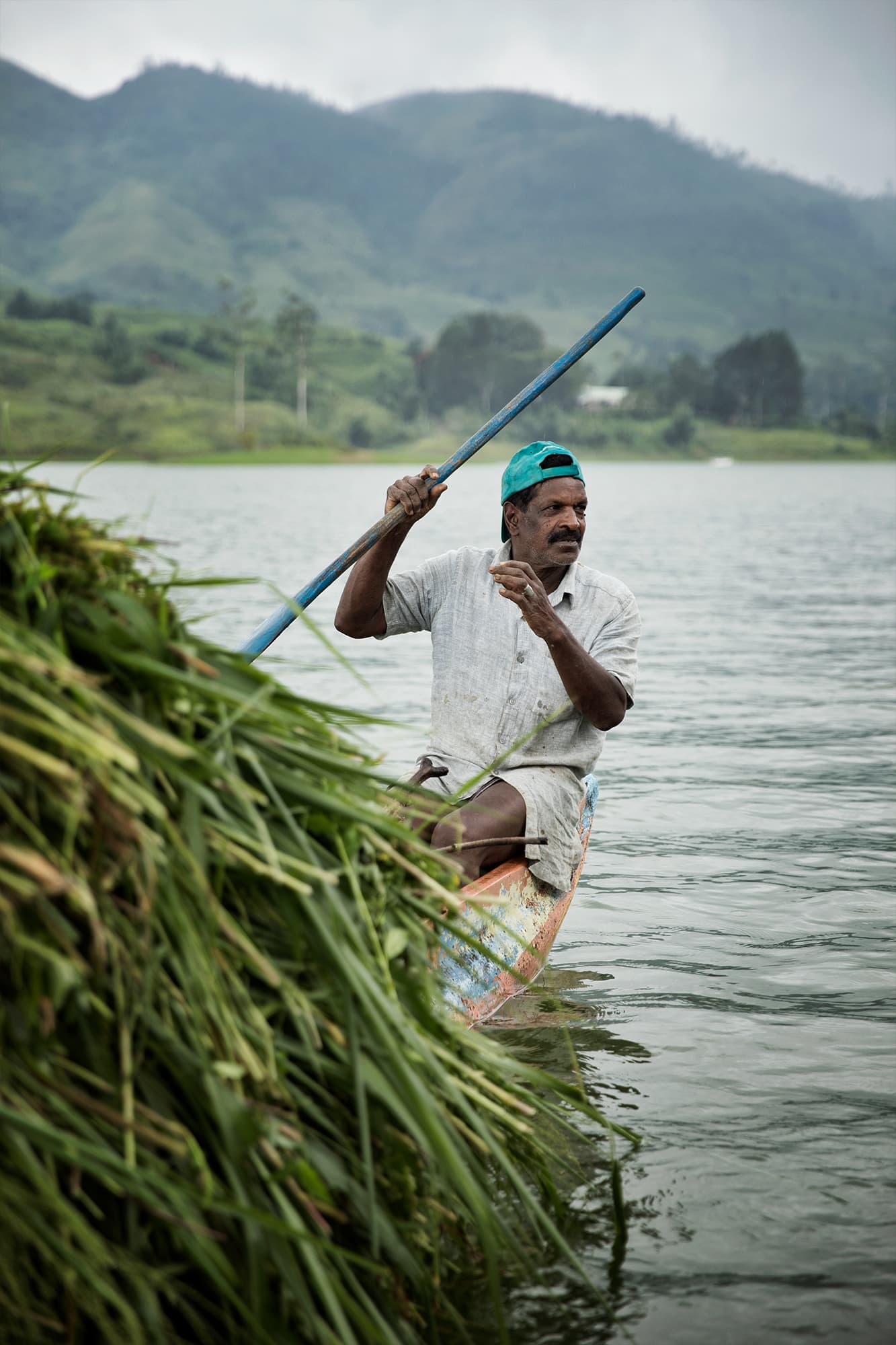 Man rowing in a lake in Sri Lanka