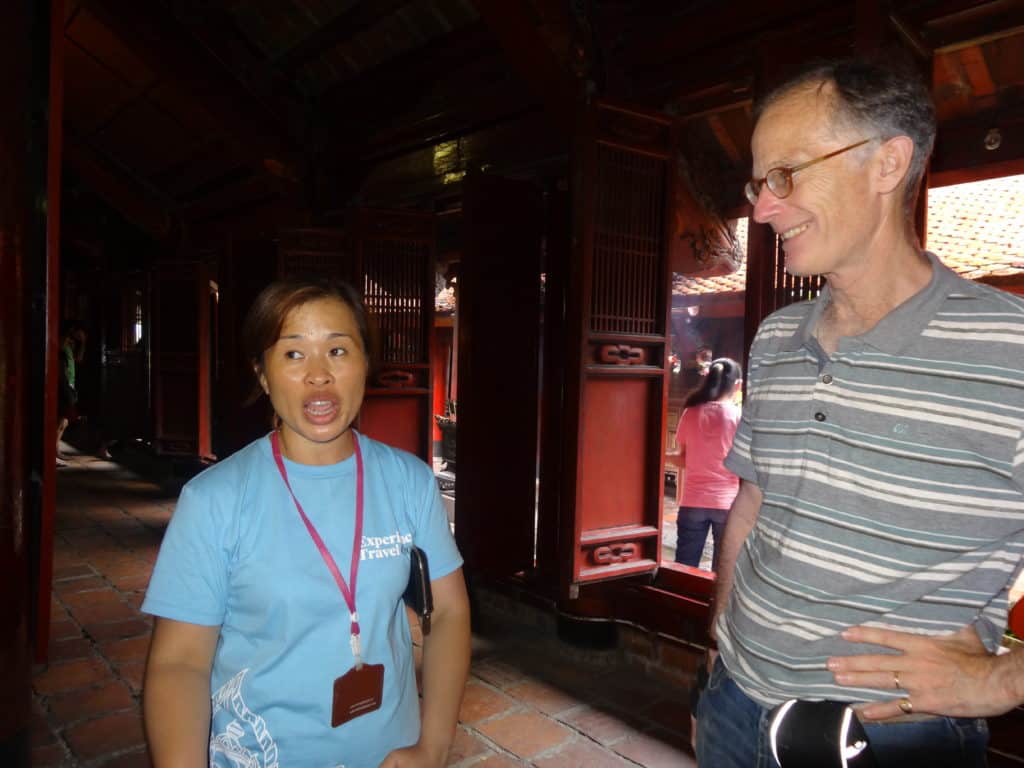 Sir John Ramsden with Experience Travel guide Ms Oanh visiting the Temple of Literature in Hanoi.