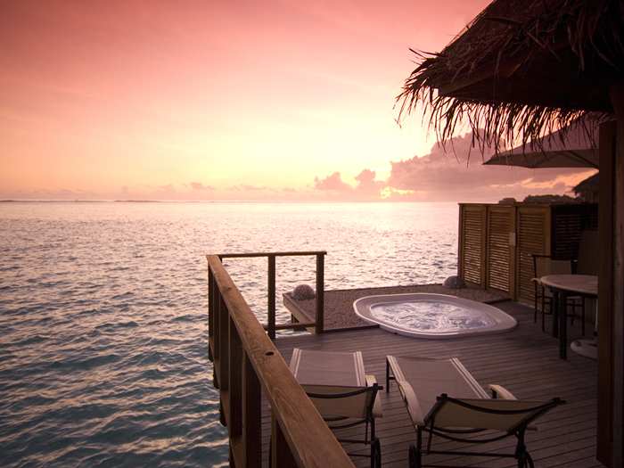 Sunset view from an over water villa in the Maldives