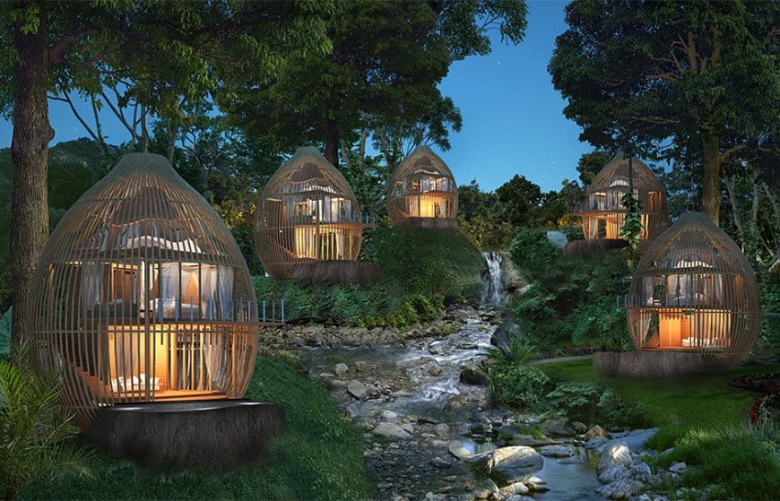 Treehouses at Keemala Phuket. A stream runs down between the treehouses with trees either side.