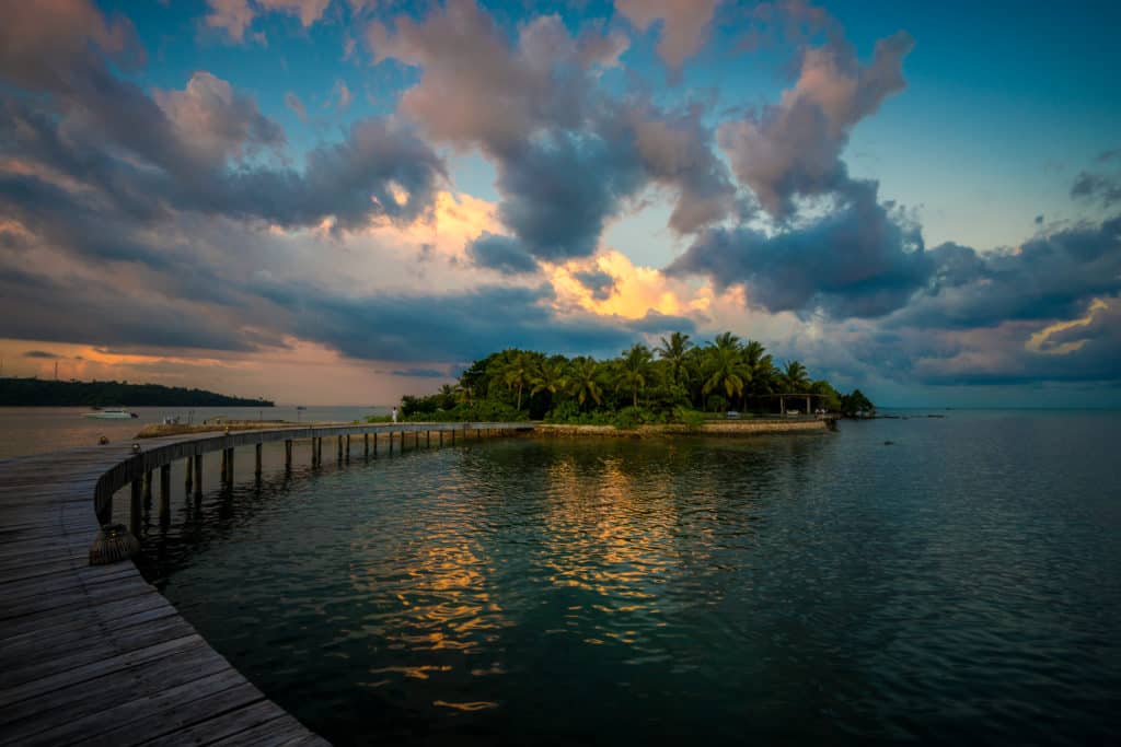 A walk way connecting islands at Song Saa Private Island Resort off the coast of Cambodia at sunset