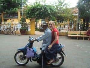 Lauren on a scooter with a local in Ho Chi Minh City