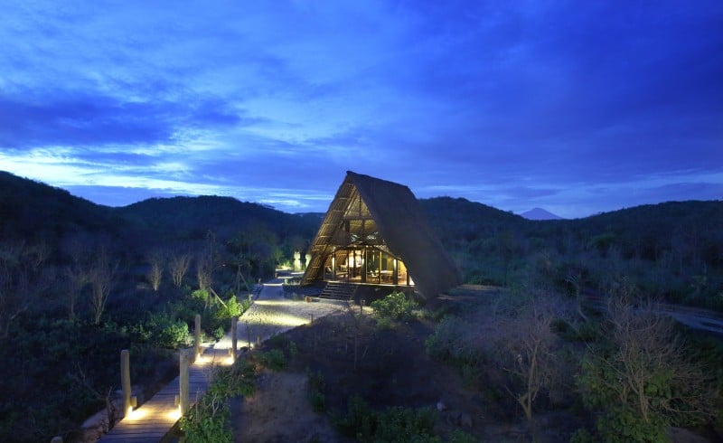A standalone bedroom at Jeeva Beloam on the east coast of Lombok in a nature forest preserve at sunset