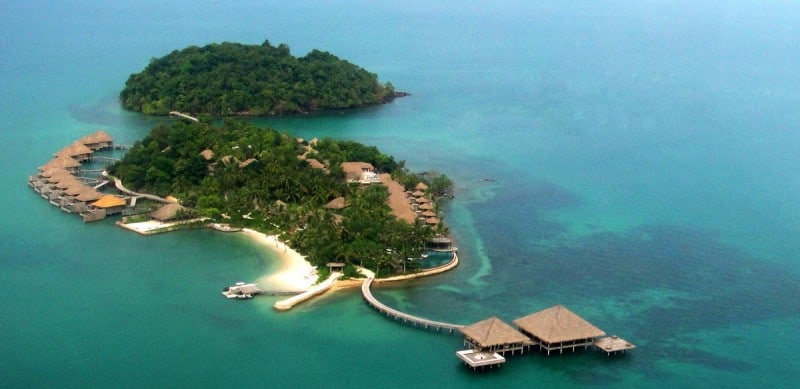 Song Saa private island resort from above with coral under the ocean