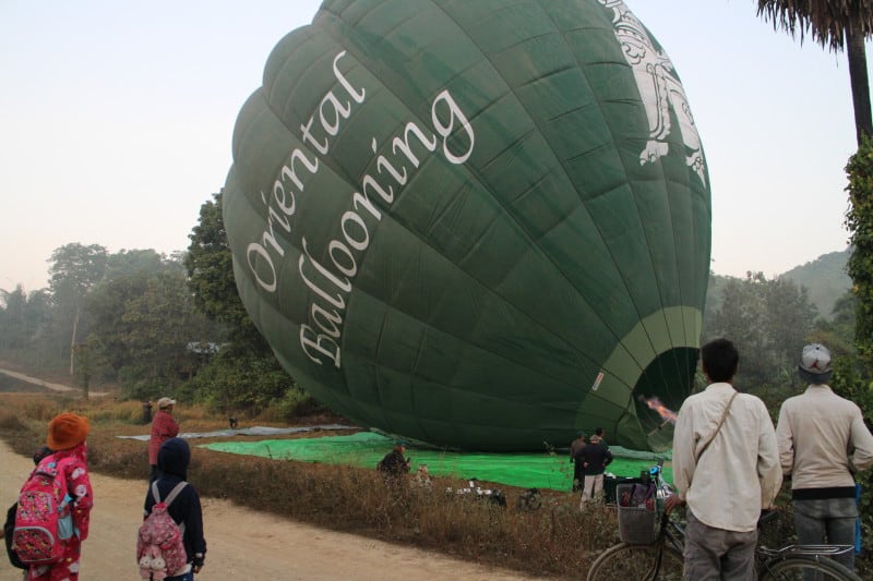 An image of a hot air balloon landing on the ground