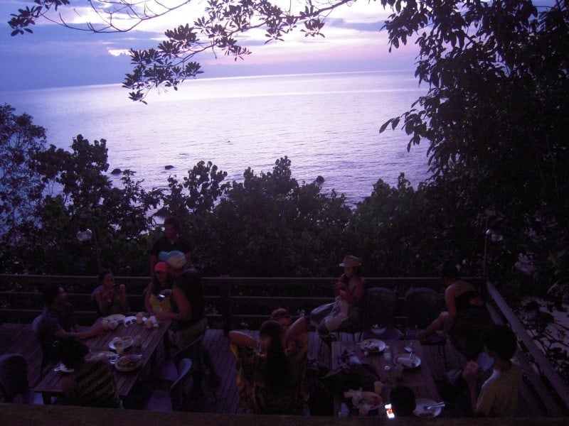 travellers eating at the restaurant of Permai Rainforest Resort which overlooks the ocean