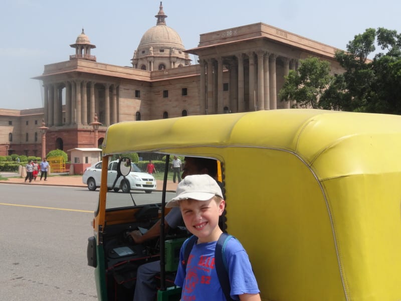 Sam's son Eddie is excited to go into a tuk-tuk in Delhi, India