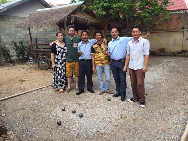 Our Travel expert Becky playing petanque with locals, one of the most authentic experiences one can have whilst visiting Laos