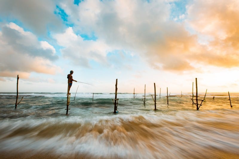 Stilt fisherman off the south coast of Sri Lanka near Koggala