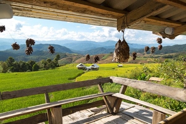 relaxing time in a homestay in thailand overlooking mountains and fields