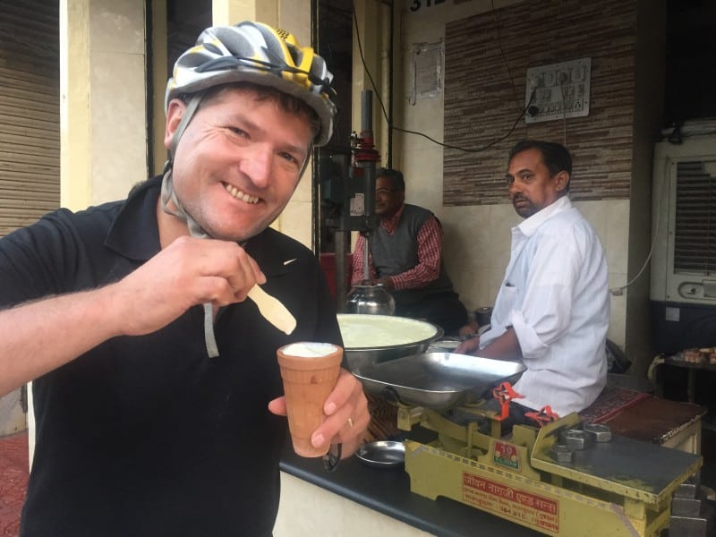 Robin McKelvie trying lassi on a early morning cycle tour of Jaipur