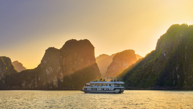 Dreamy sunset among the rocks of Halong Bay, Vietnam