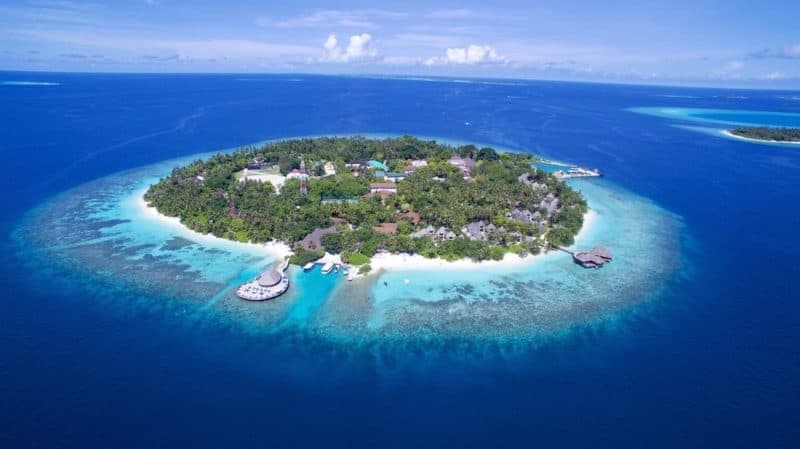 Bandos island from above with beautiful coral surrounding the island