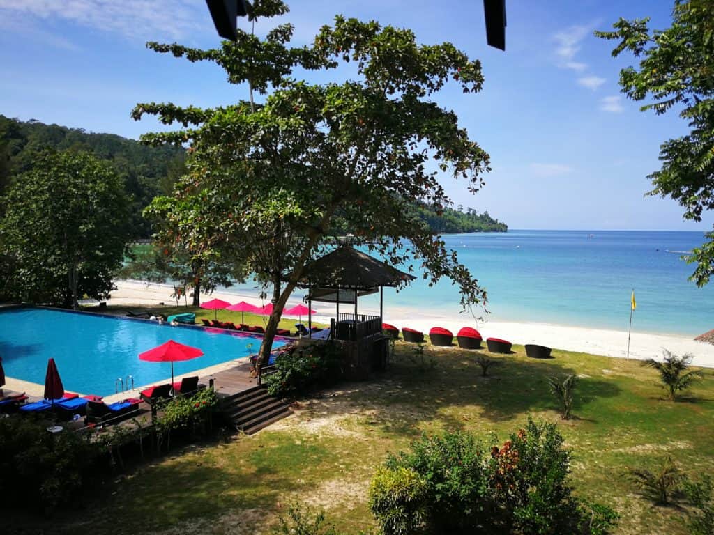 The private beach of Bunga Raya on Gaya Island Resort with pool in the foreground