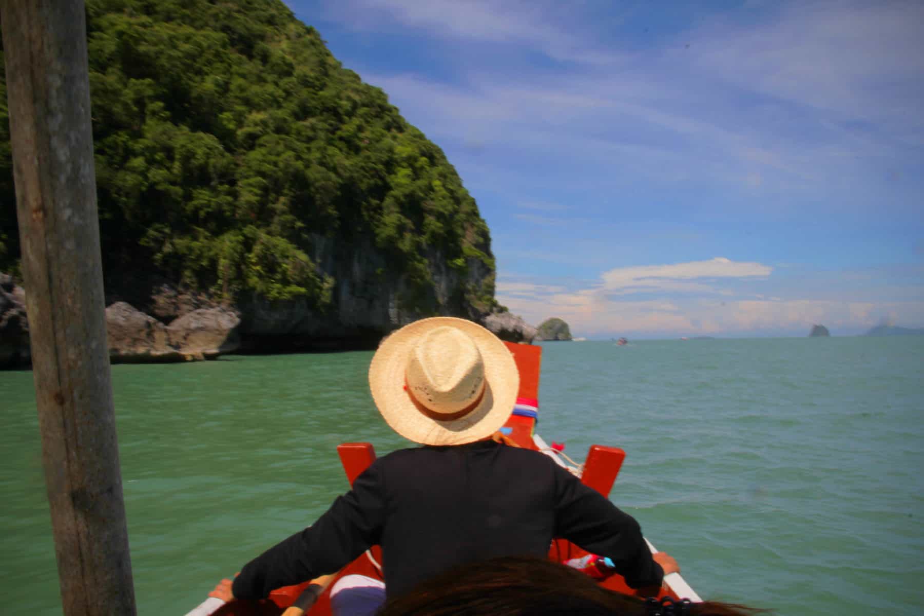 man sitting on a boat in Khanom in Thailand