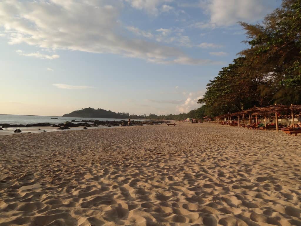 Sunset on Ngapali beach with sun beds looking onto the ocean