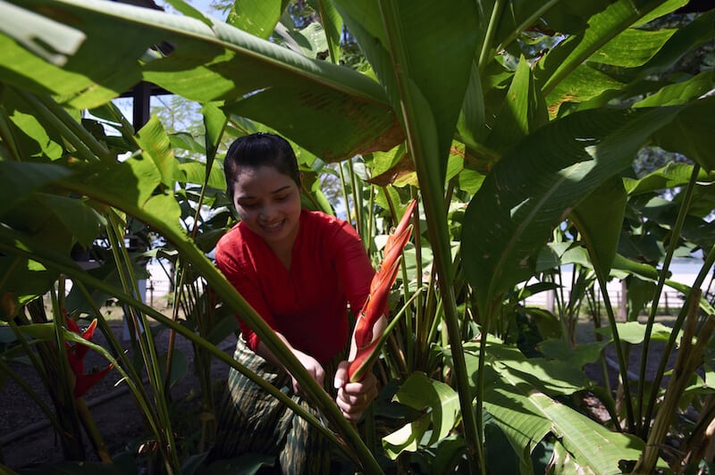 Staff member getting fresh ingredients from the vegetable plot at La Folie Lodge