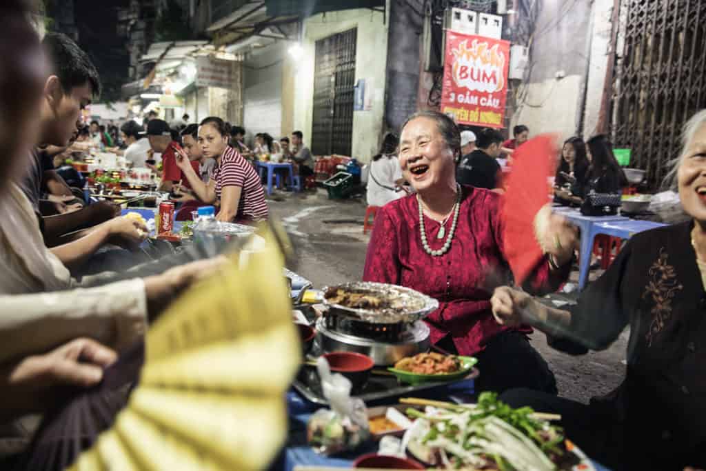 Evening Street food scene in Hanoi with locals