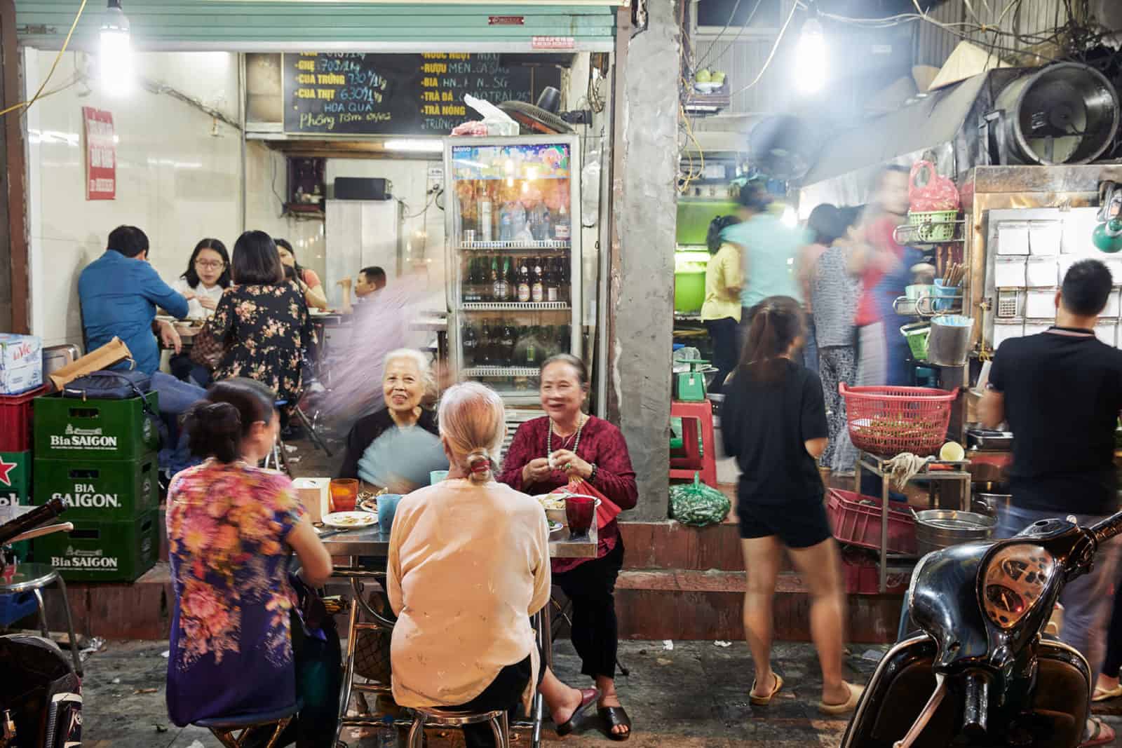 Locals sat outside a cafe in Hanoi in the evening