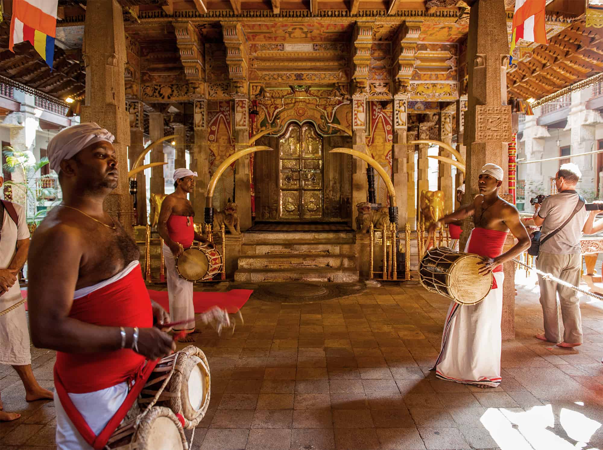 Worshippers with drums in the temple of the tooth