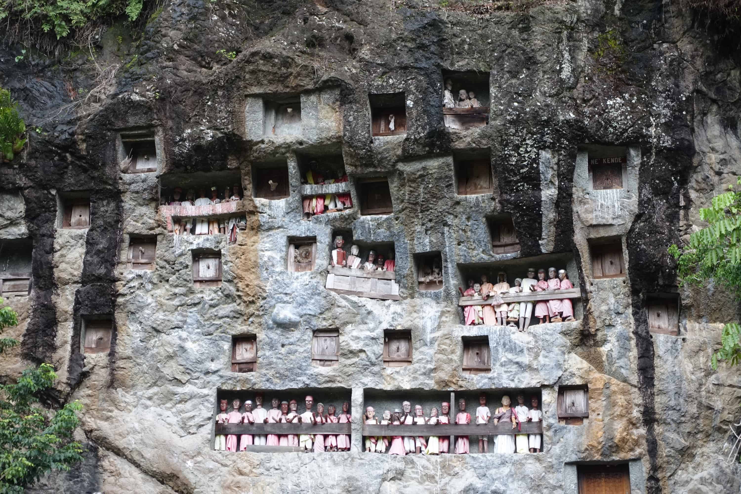 coffins laid to final rest in rock dwellings in tana toraja