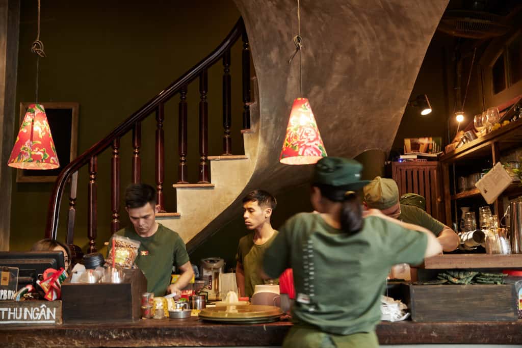 interior of a cafe in Ho Chi Minh city with a staircase in the background