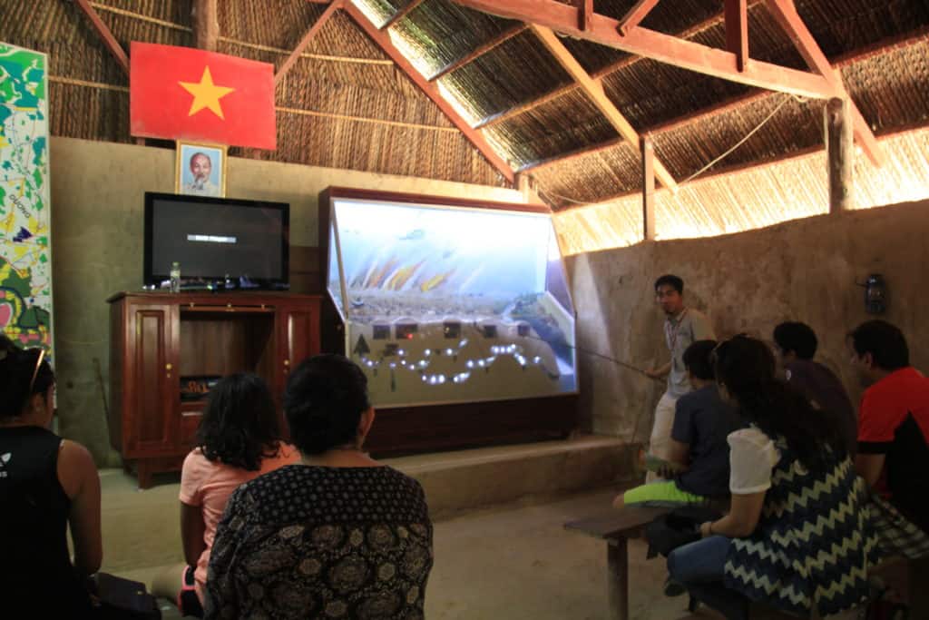 Tourists learning about the Cu Chi tunnels outside Ho Chi Minh City, Vietnam