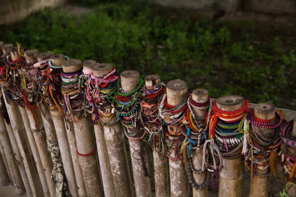 Bracelets on a fence outside the killing fields of Phnom Penh