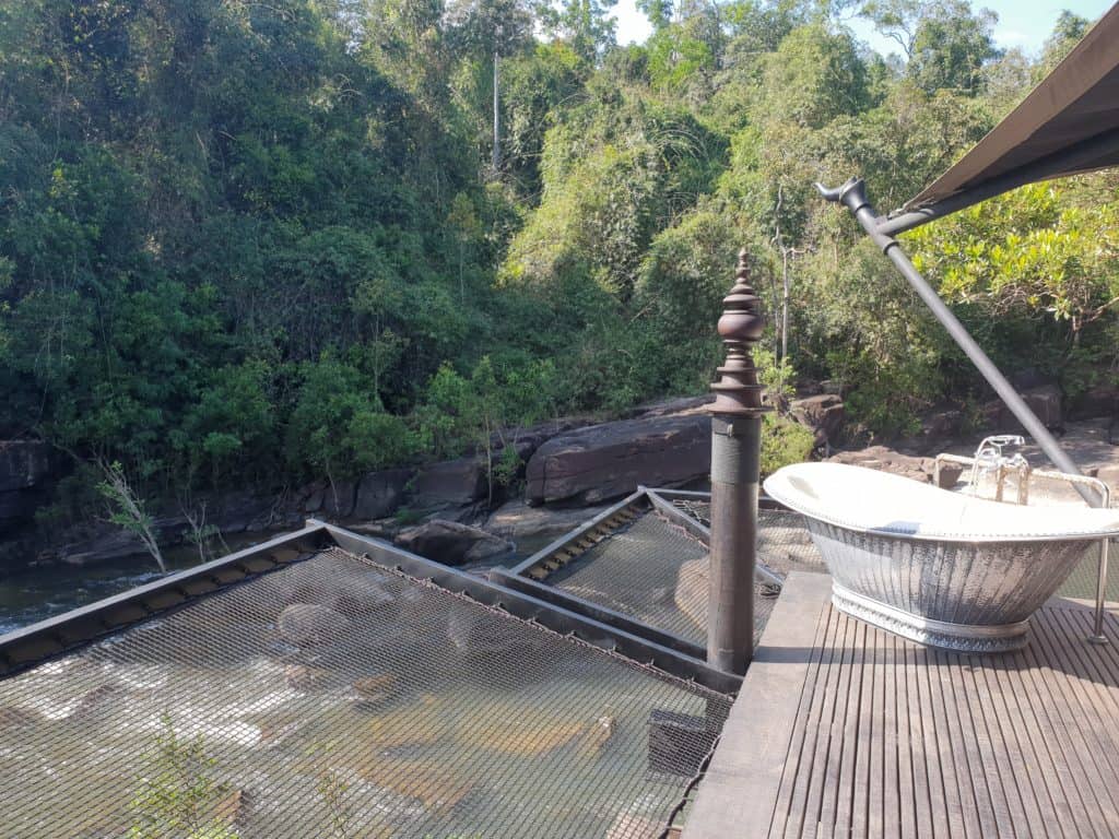 An outdoor bath at Shinta Mani Wild, surrounded by rainforest