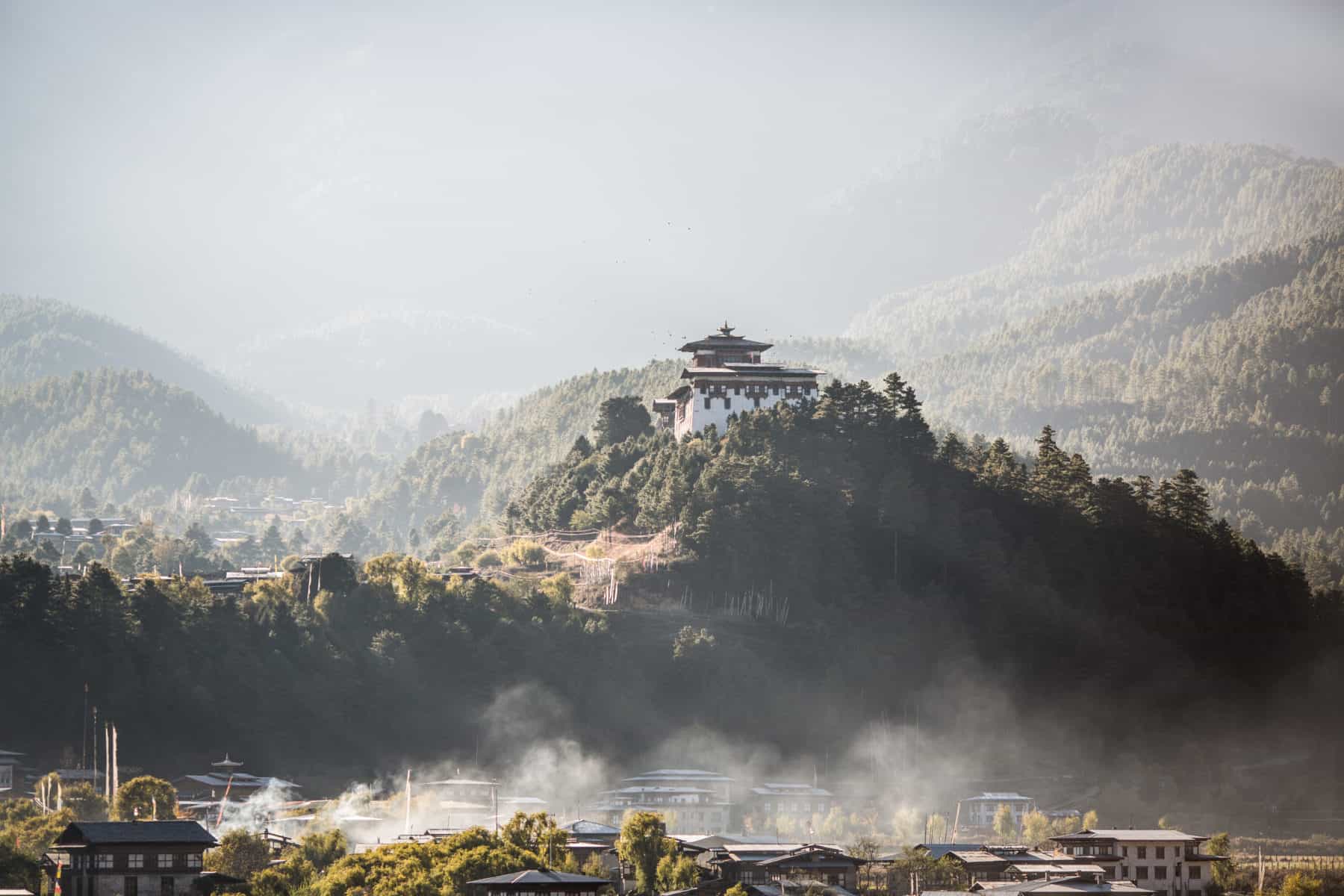 Bumthang Dzong at sunrise in Bhutan as the mist lifts