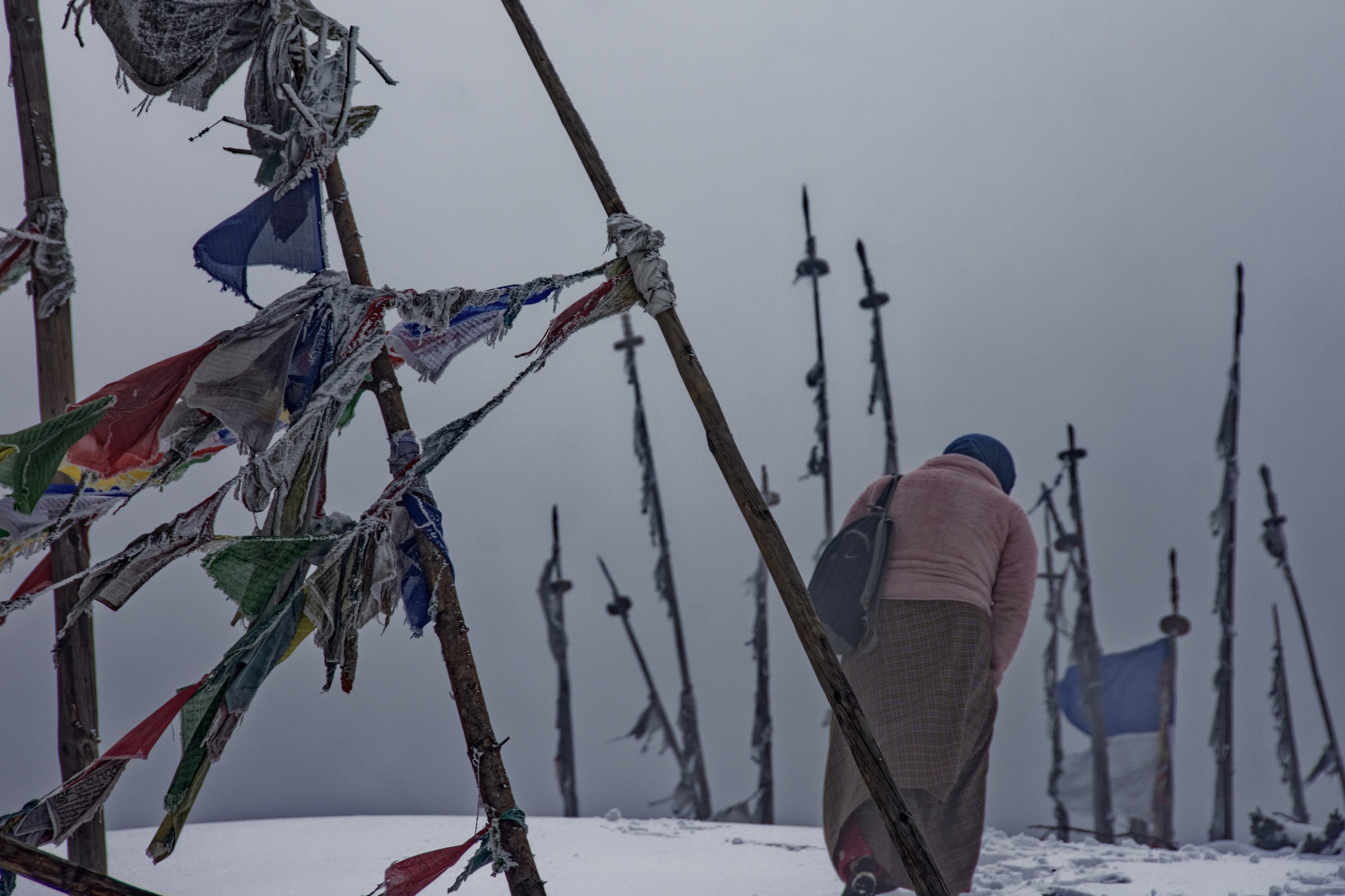 Snowy mountains and prayer flags in Bhutan