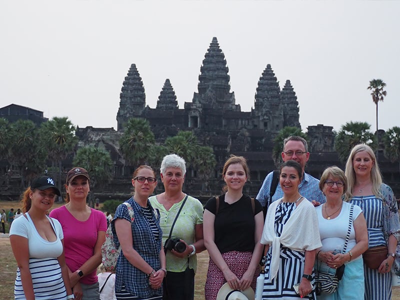 Travellers in front of Ankor Wat in Cambodia