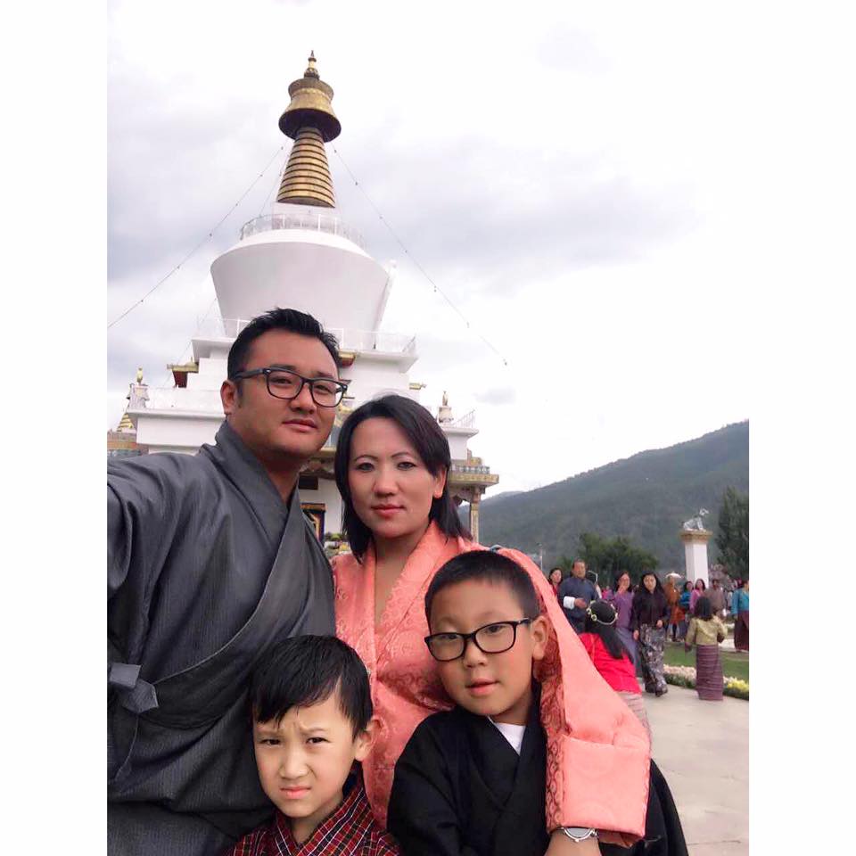 Family wearing traditional robes in Bhutan