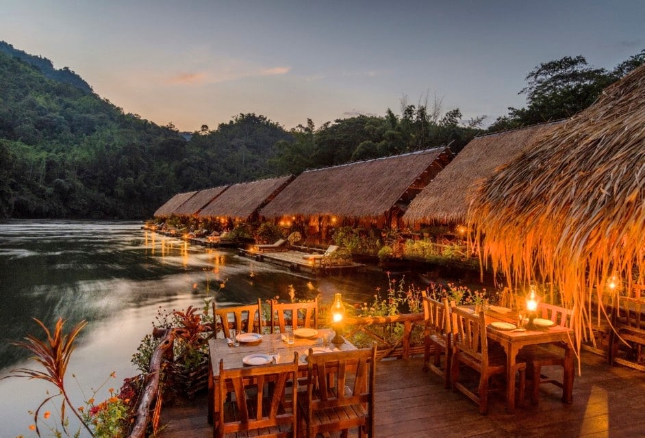 row of resort villas on the river kwai in thailand