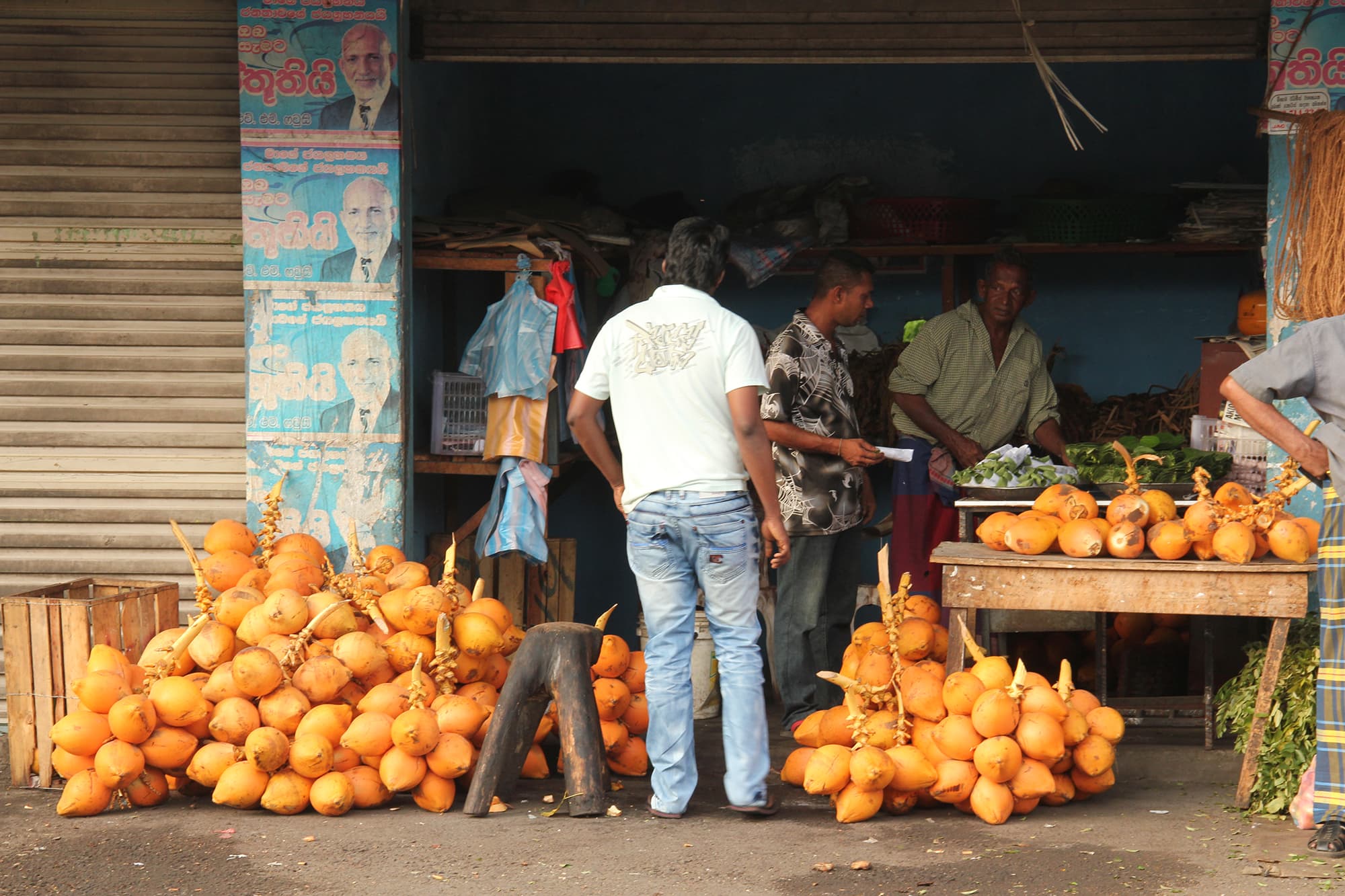 Locals barter over fruit in a market in sri Lanka