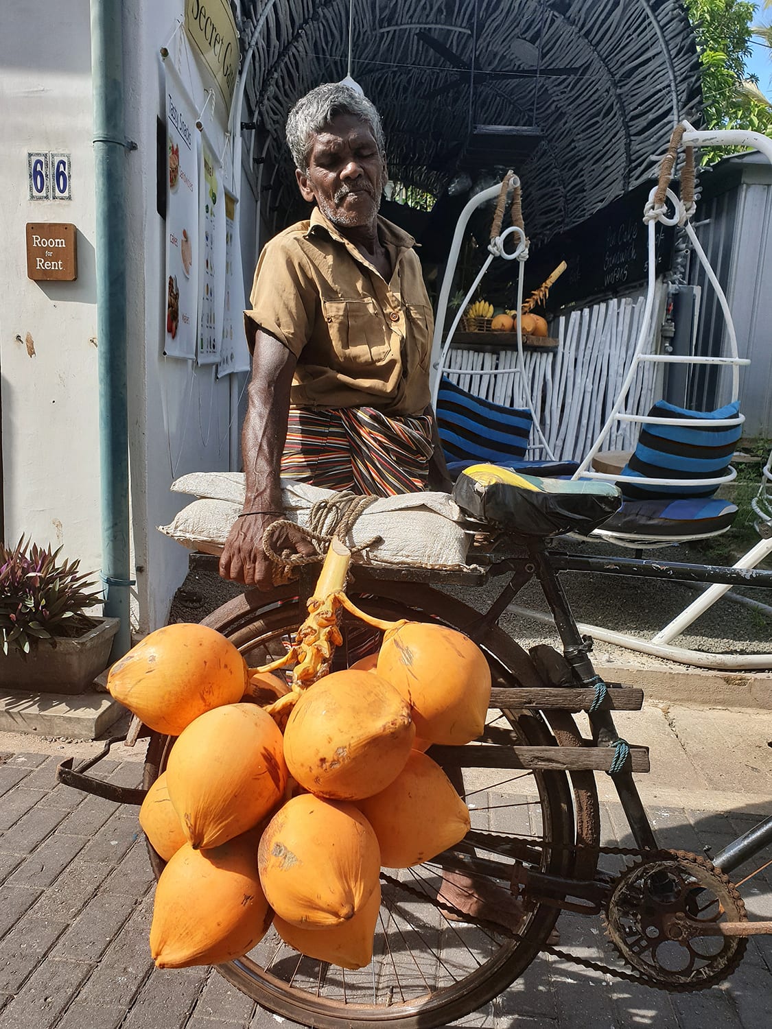 Mango trader in Sri Lanka with an old bike