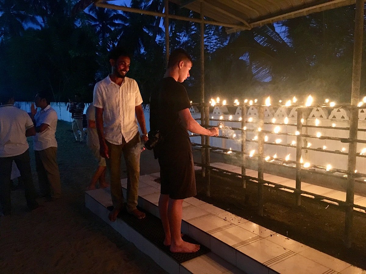 Candle lighting at temple Poya day Sri Lanka