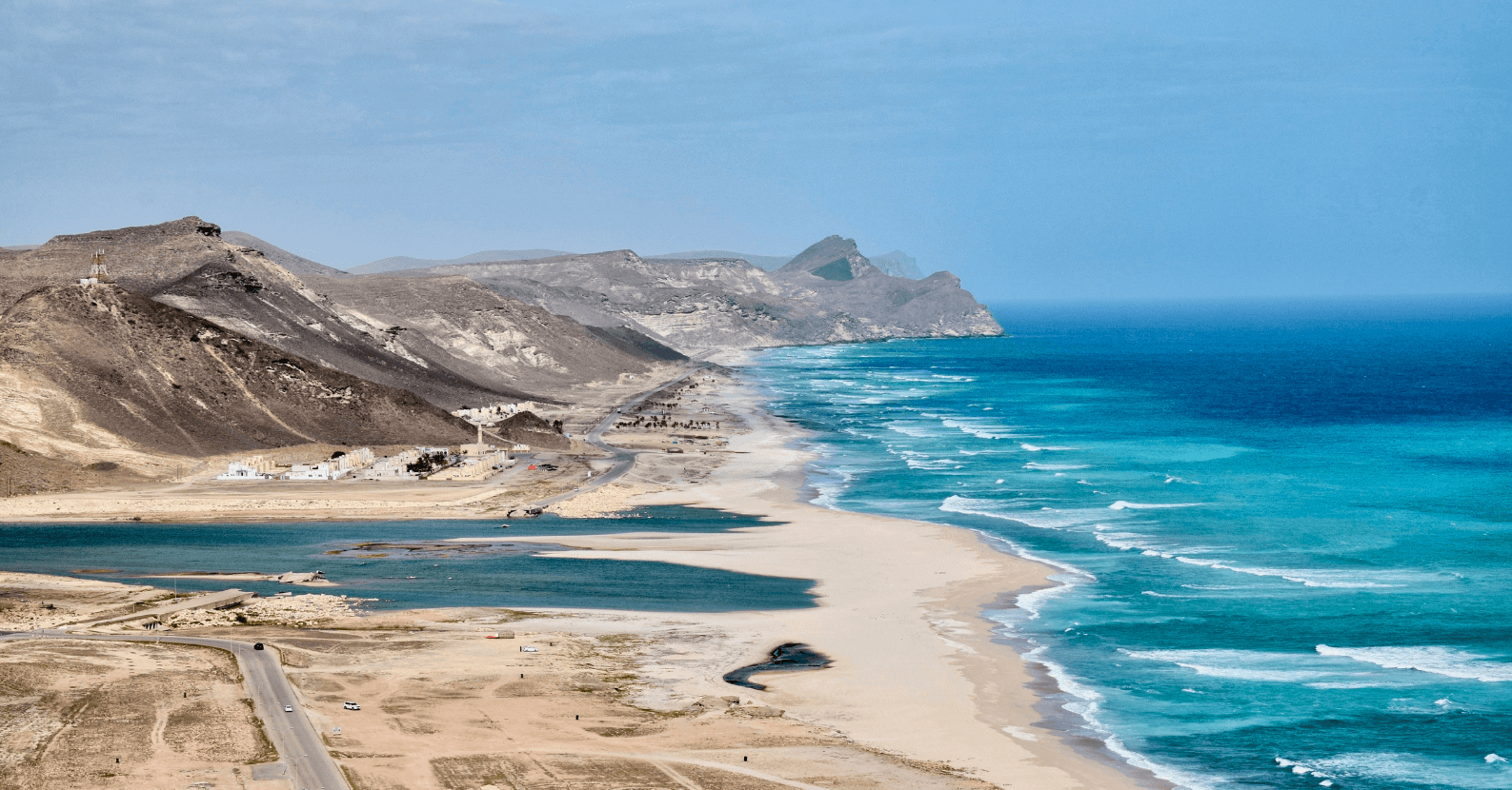Rugged coastline and beach in Oman