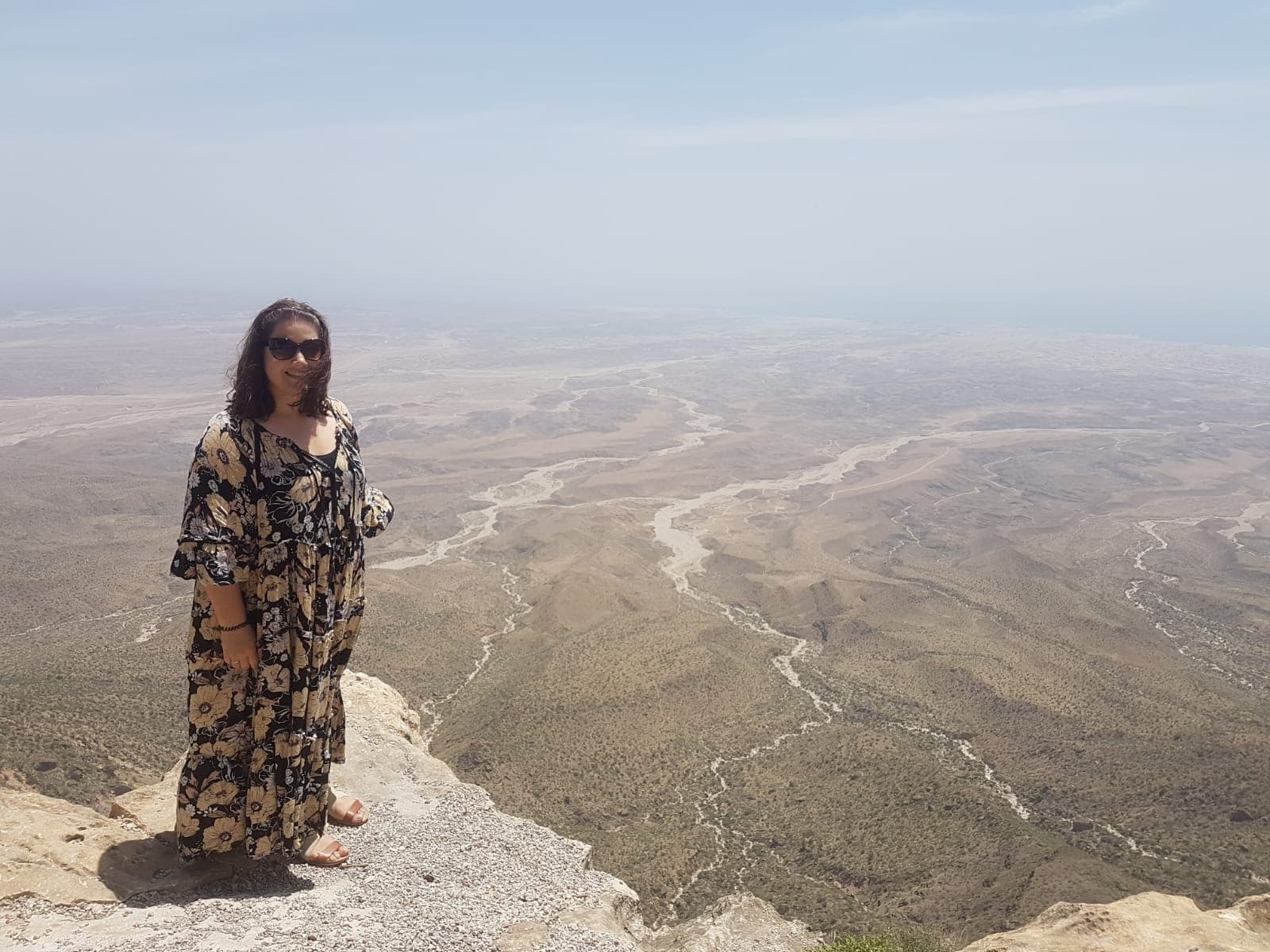 Traveller with a backdrop on the desert in Oman