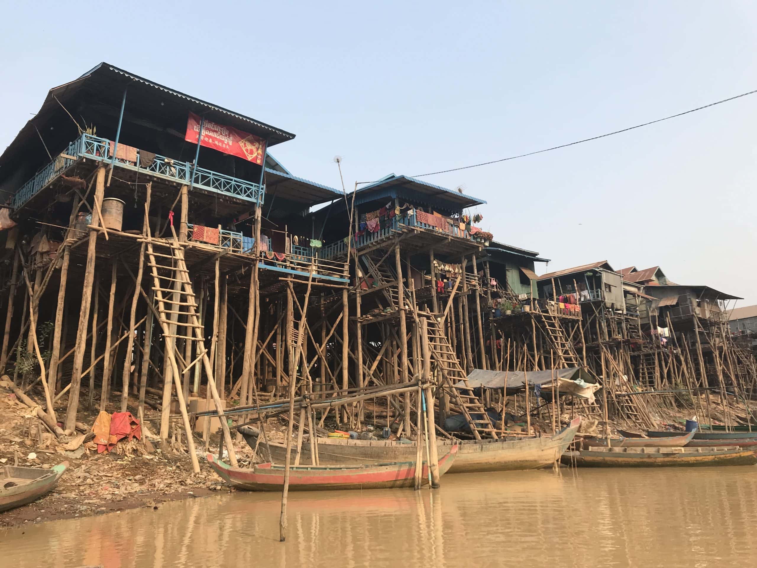 Kampong Phluk stilted buildings from below in a boat