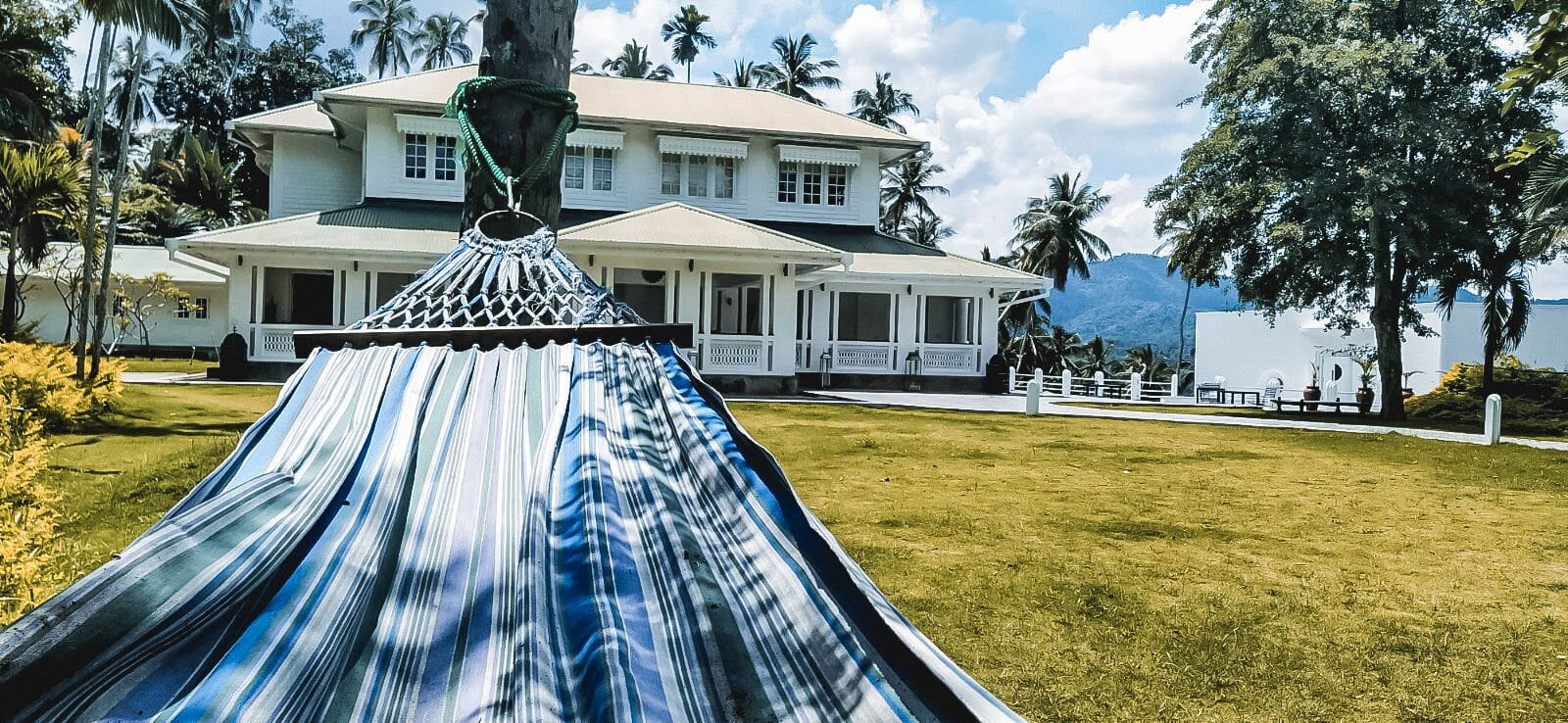 Hammock in the grounds of Flame Tree Hotel Kandy with the main house in the background