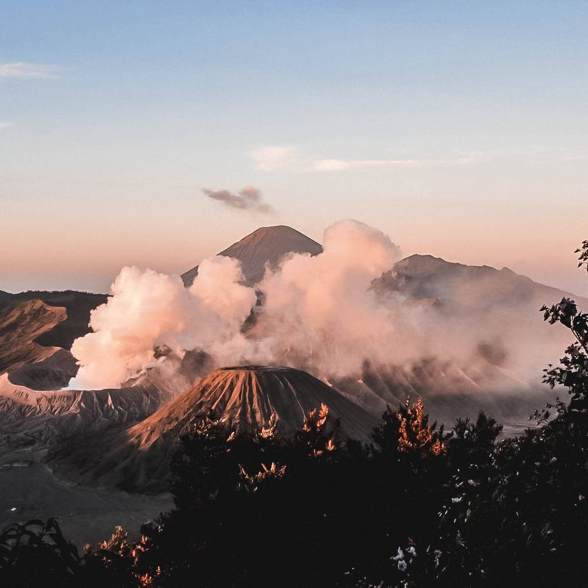 Mount Bromo in Indonesia at sunrise with clouds in the background