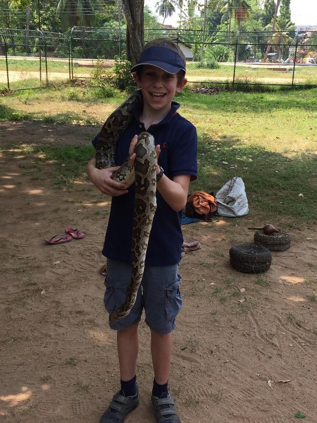 Child With Snake Sri Lanka