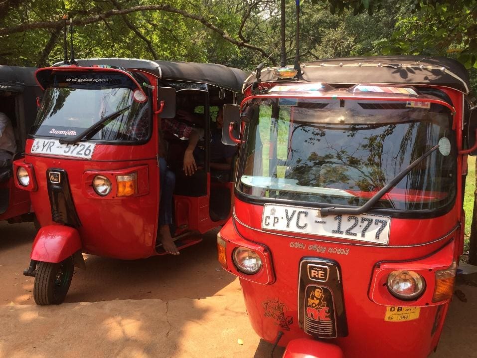 Two red tuk tuks in Sri Lanka