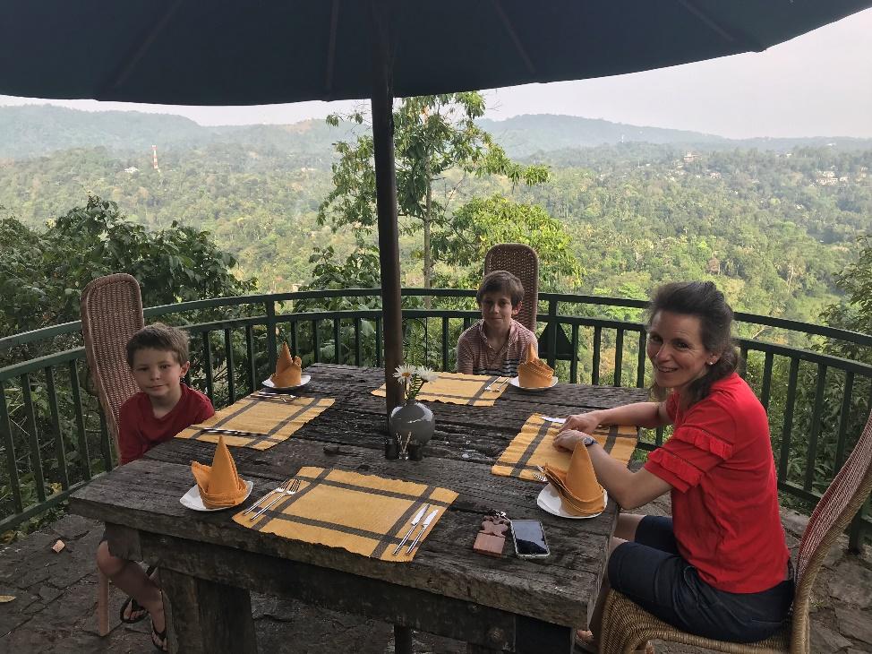 A Family Dining Sri Lanka with a great view behind them