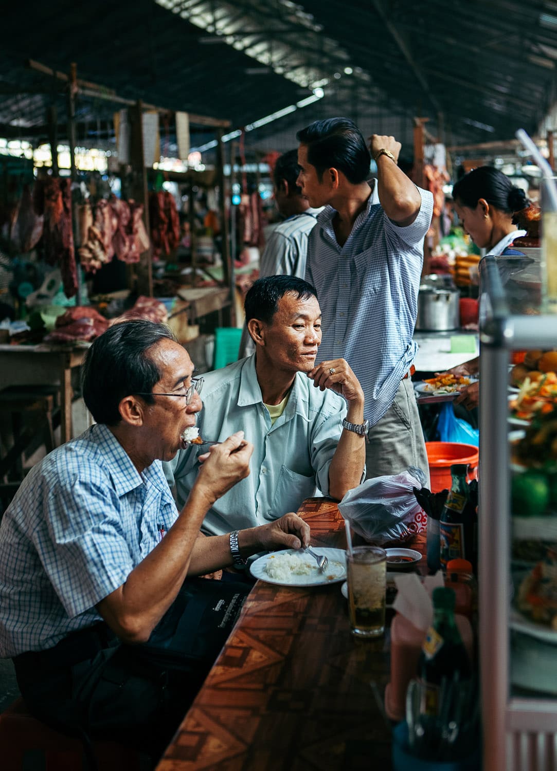 Locals eating in a Phnom Penh, market, Cambodia