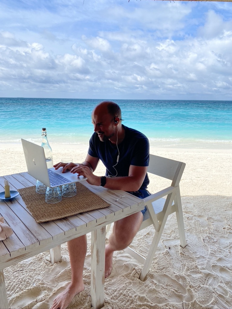 Matt working on a beach in the Maldives