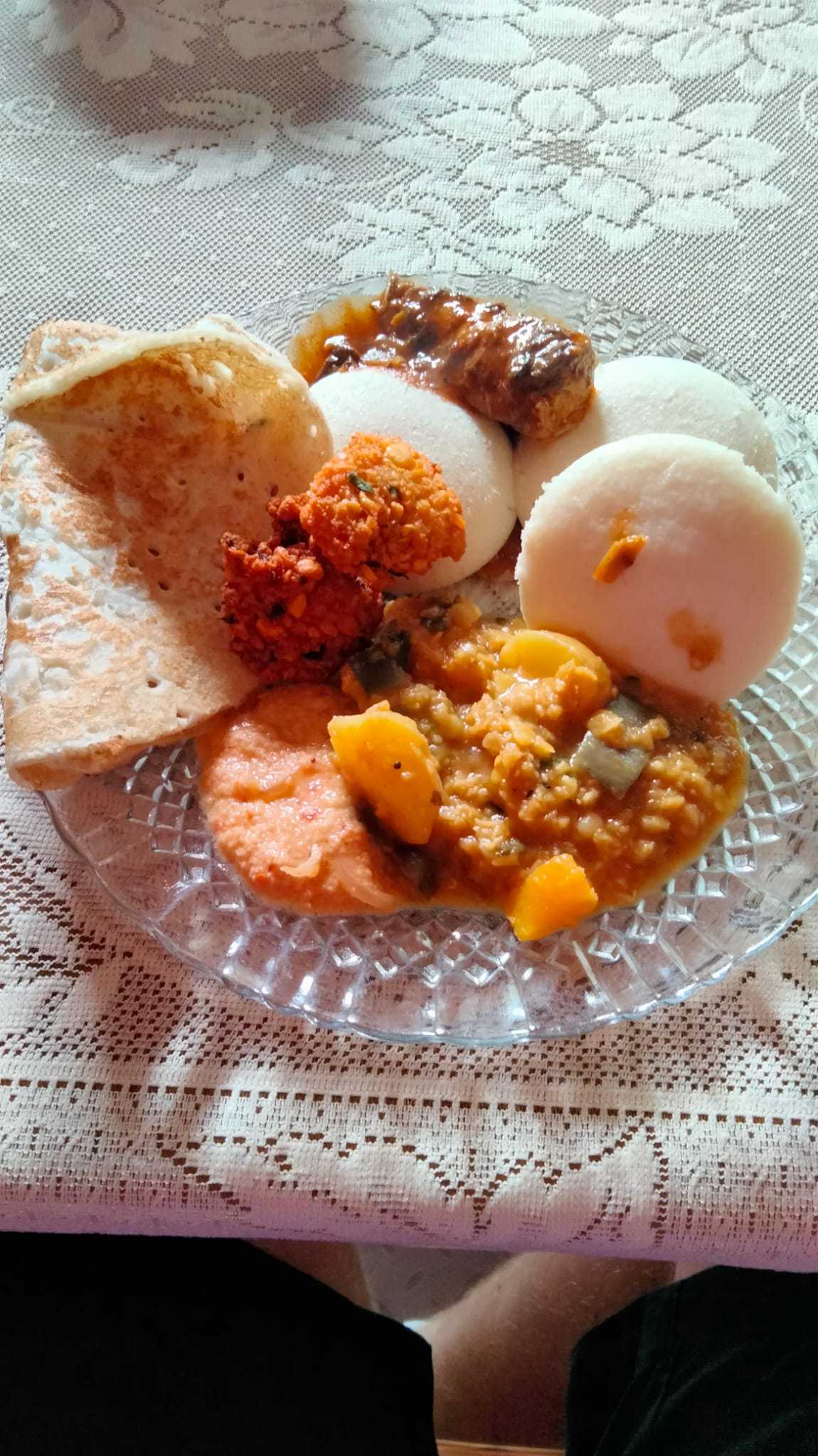 A plate of tamil food in Sri Lanka; Daal, Idli, Kulambu